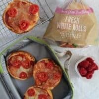 Mini gluten free pizzas made from bread rolls.