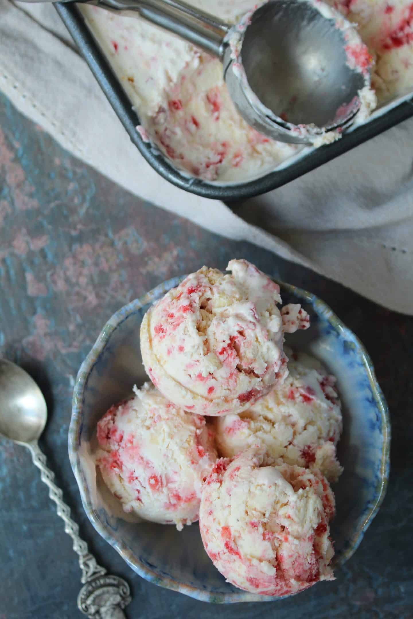 a bowl of strawberry cheesecake ice cream.