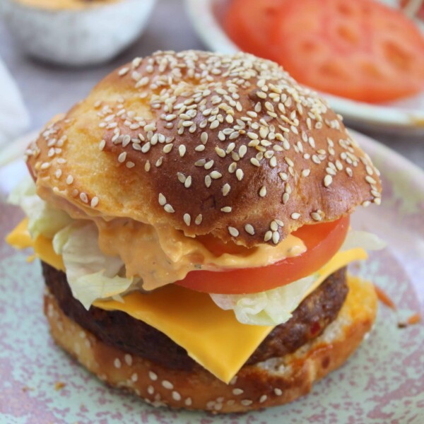 A gluten free hamburger with cheese.