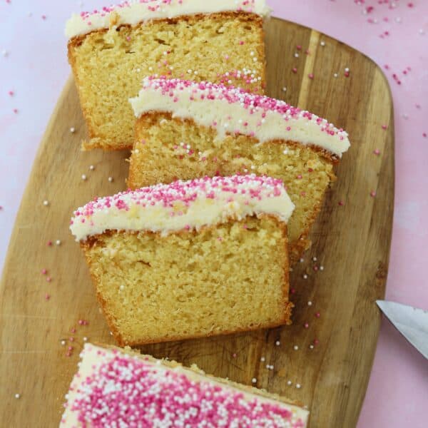 gluten free vanilla loaf cake recipe slices on a chopping board.