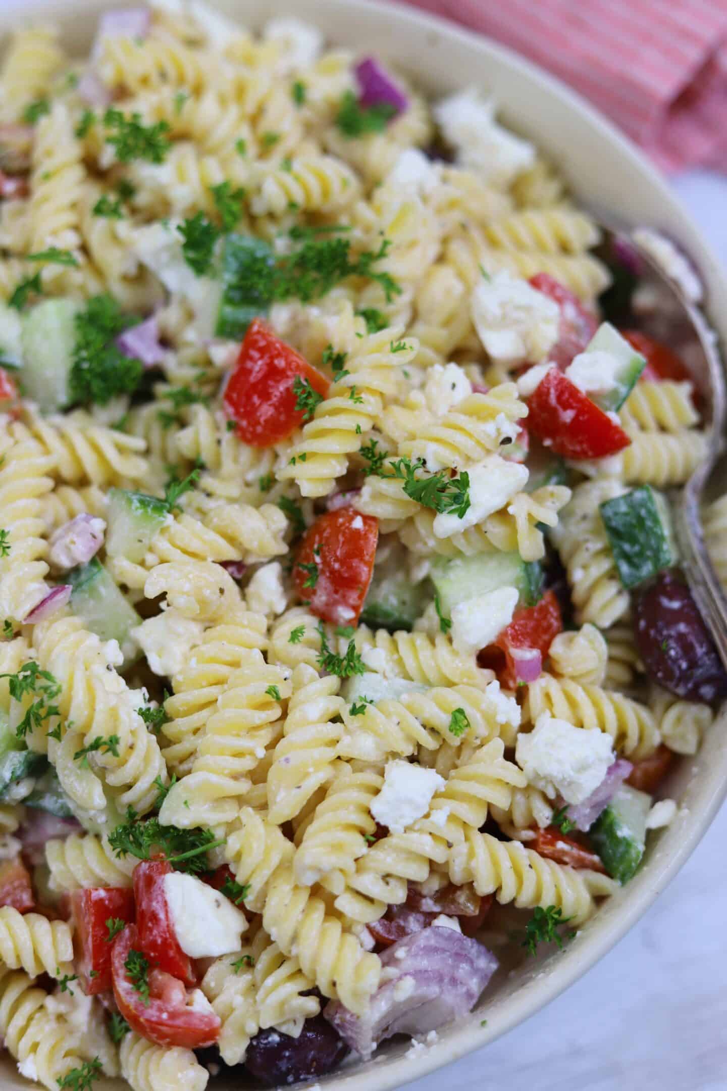 Close up shot of Greek pasta salad.