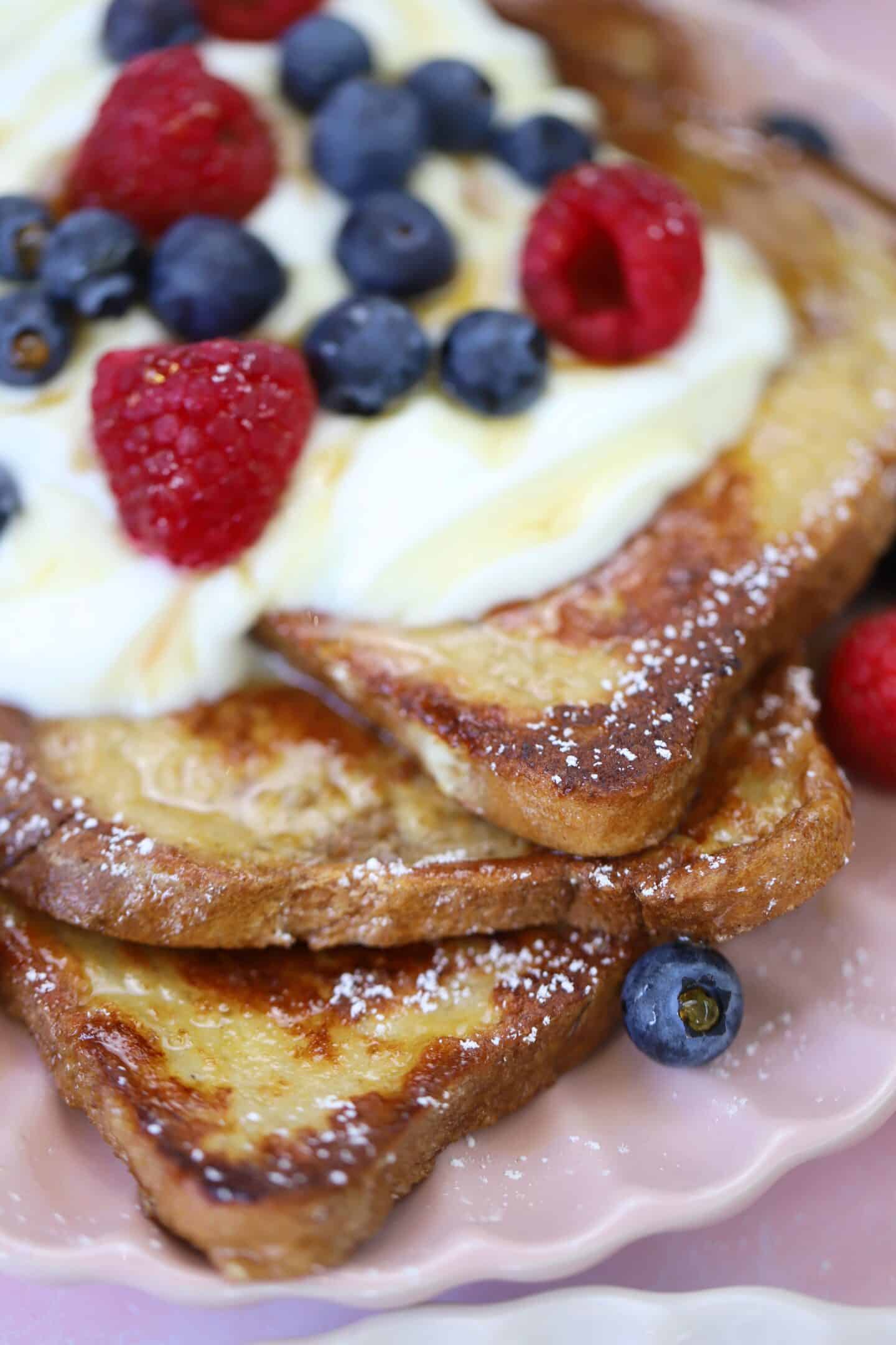 A stack of French toast with yoghurt and berries.