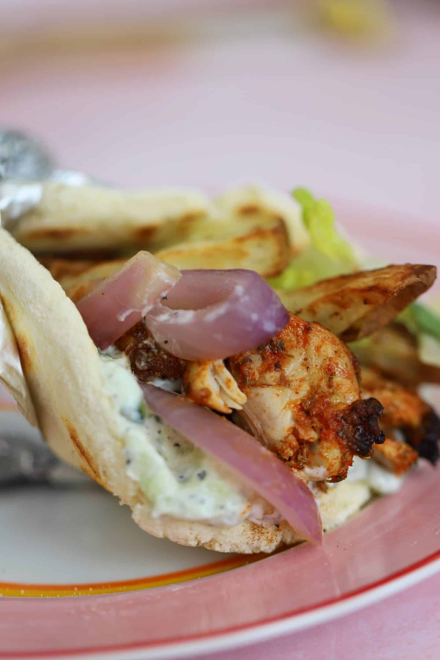 Close up of a gluten free gyro on a plate.