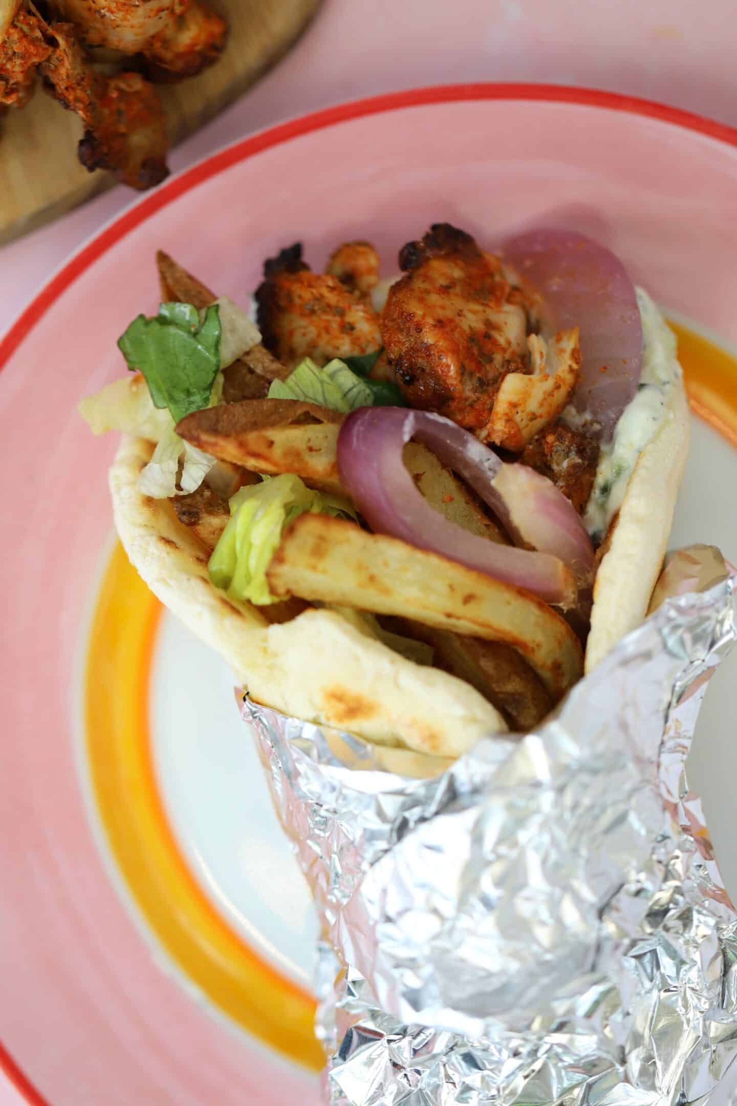 A gluten free chicken gyro wrapped in foil.