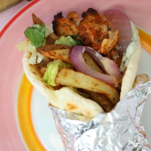 A gluten free chicken gyro wrapped in foil.