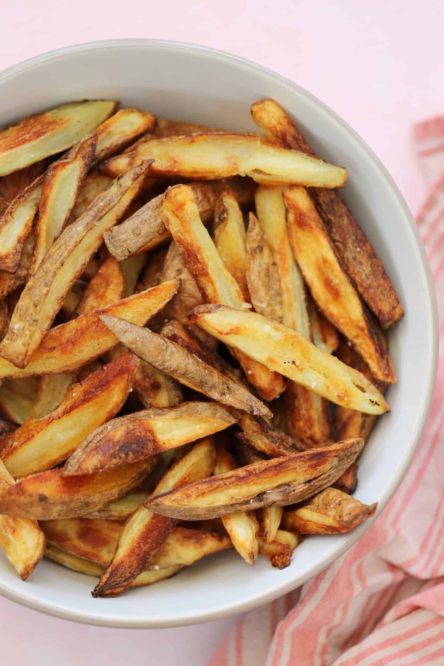 A bowl of homemade oven chips.