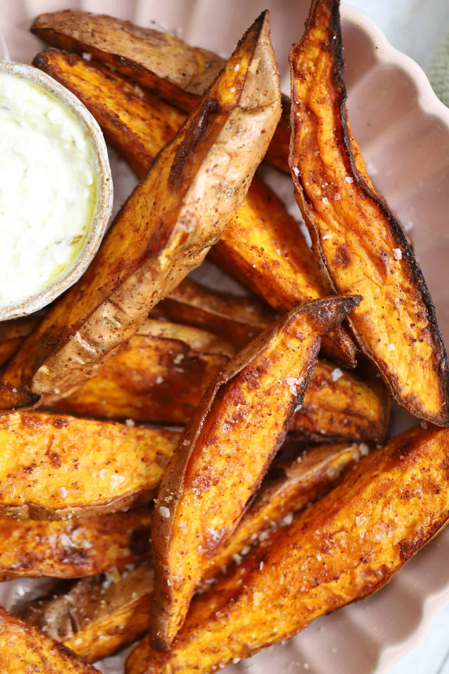 Air fried sweet potato wedges in a bowl.