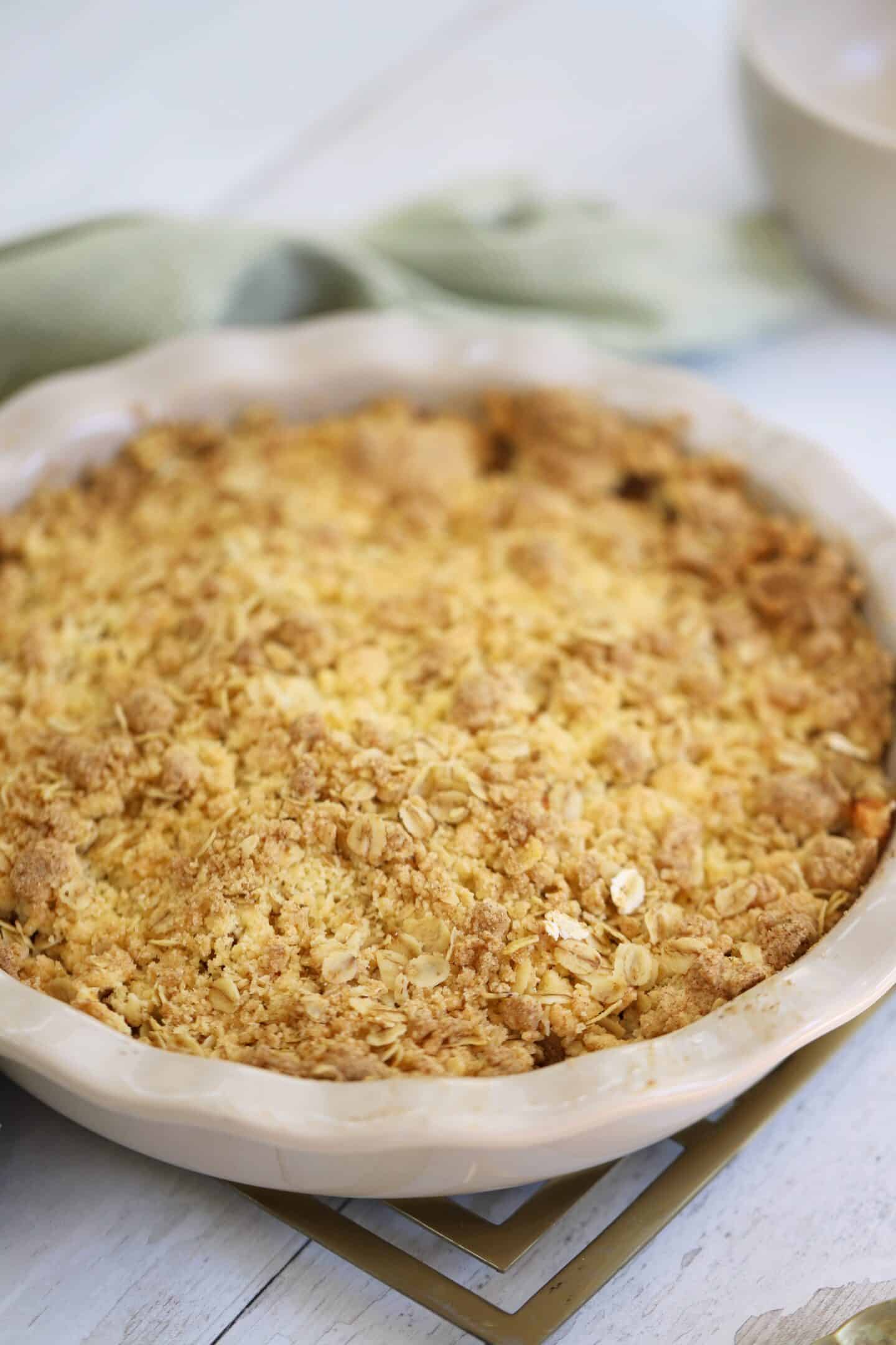 A gluten free apple crumble in a round dish.