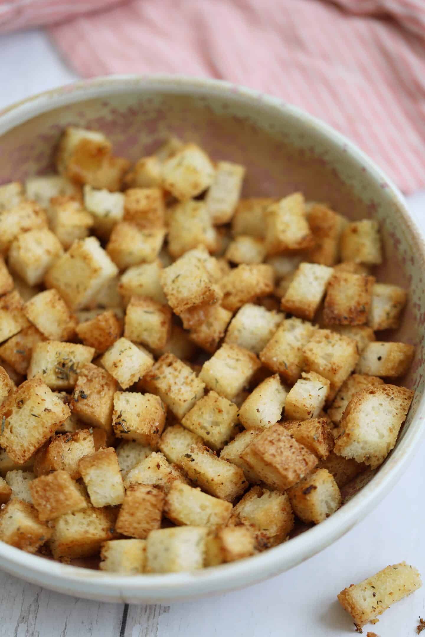 Close up of a bowl of gluten free croutons.
