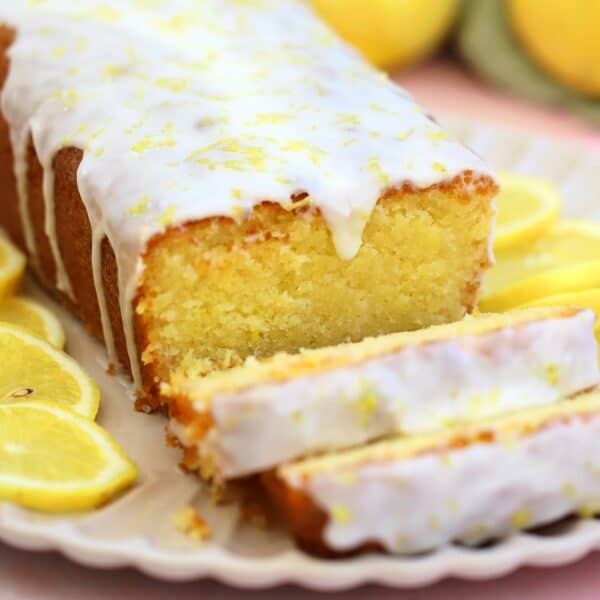 A lemon drizzle cake on a plate.