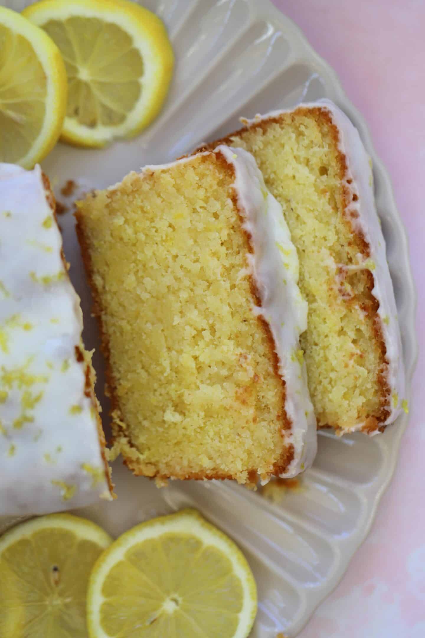 Slices of gluten free lemon drizzle cake on a plate.