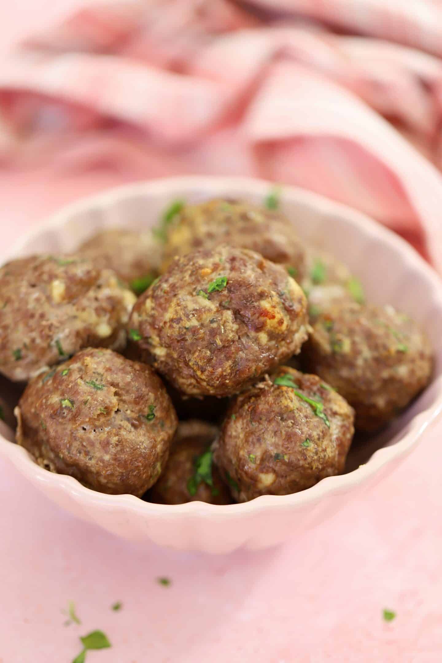 A bowl of gluten free meatballs with no sauce.