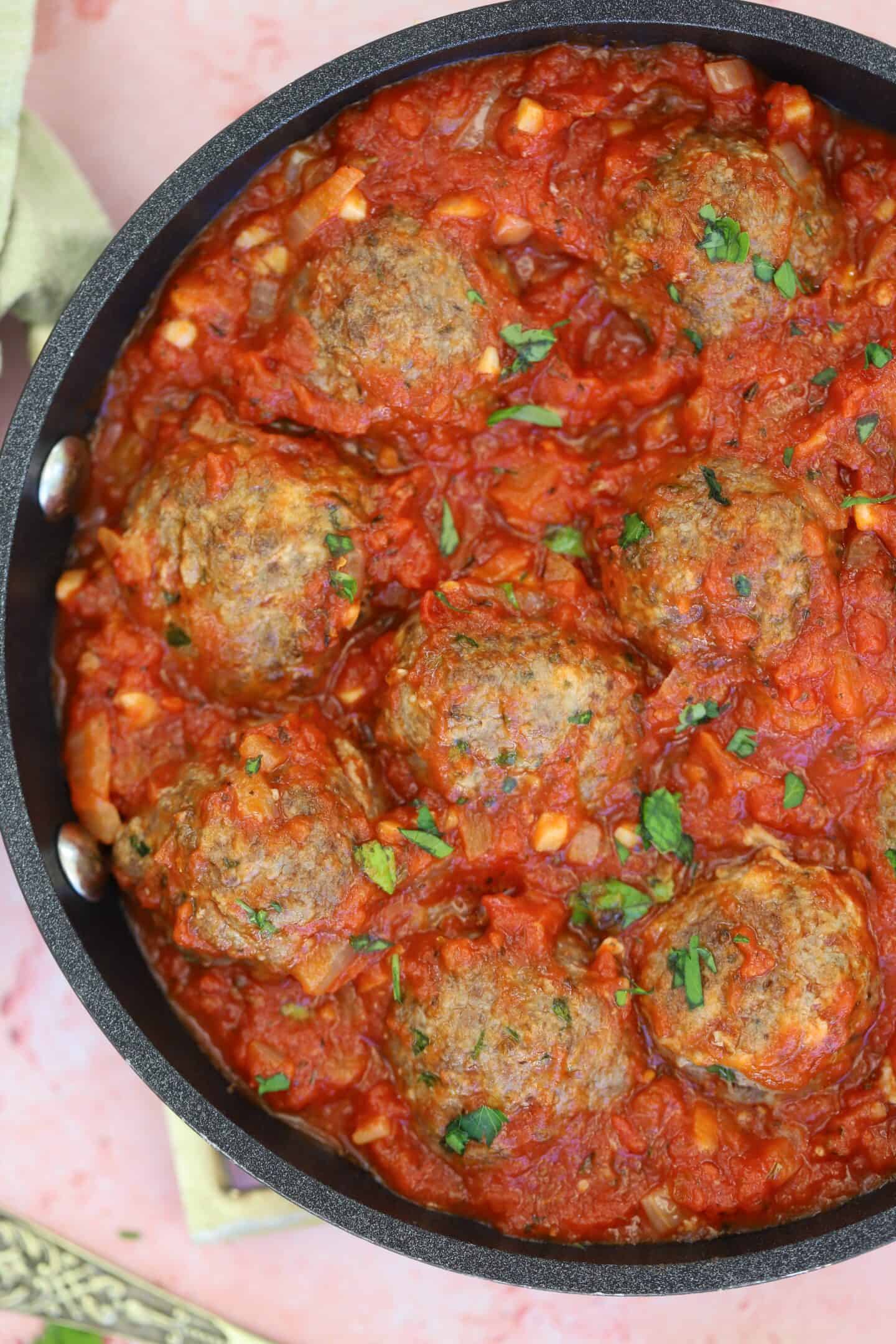 A pan of gluten free meatballs in tomato sauce.