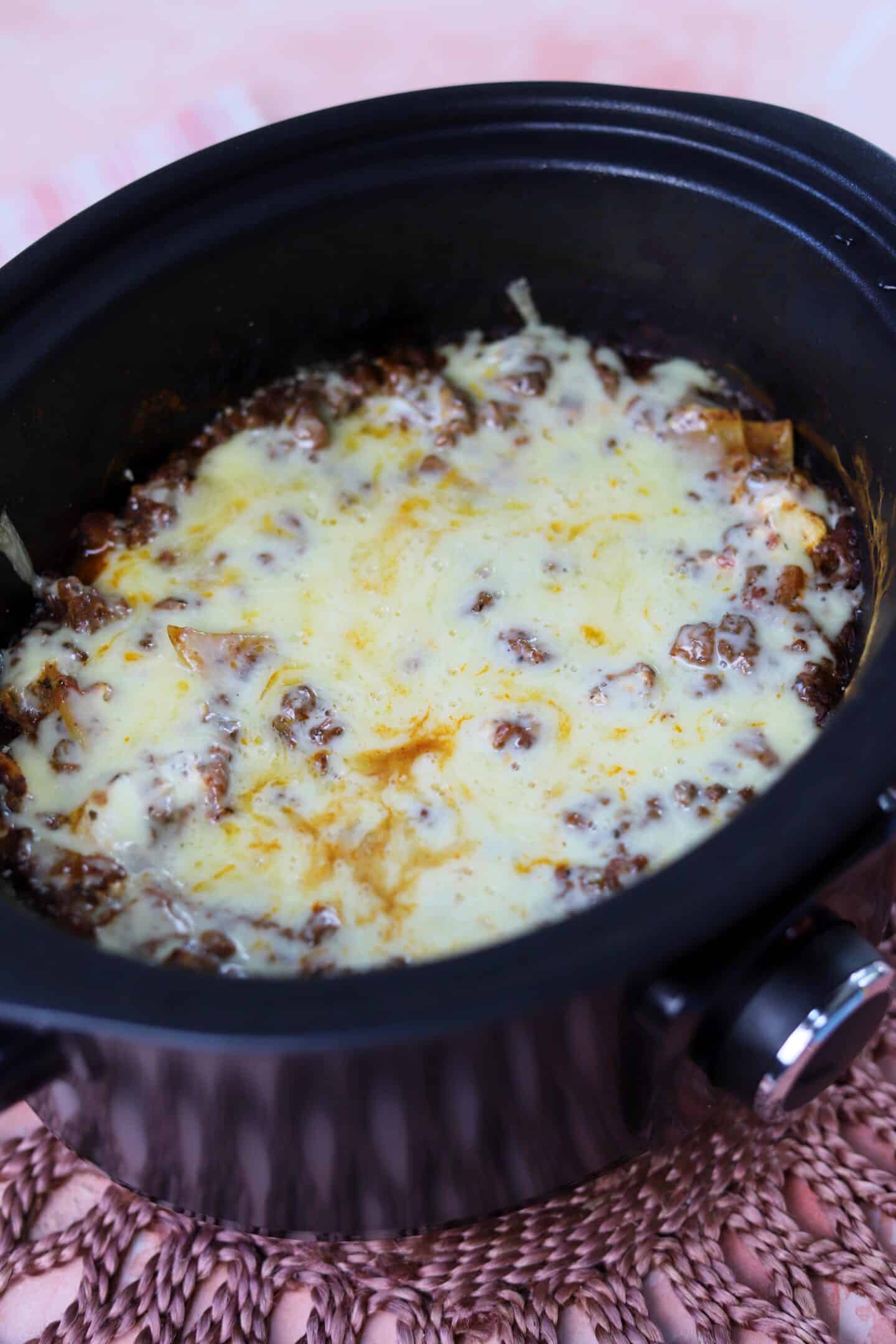 Lasagne in the slow cooker with a cheese topping.