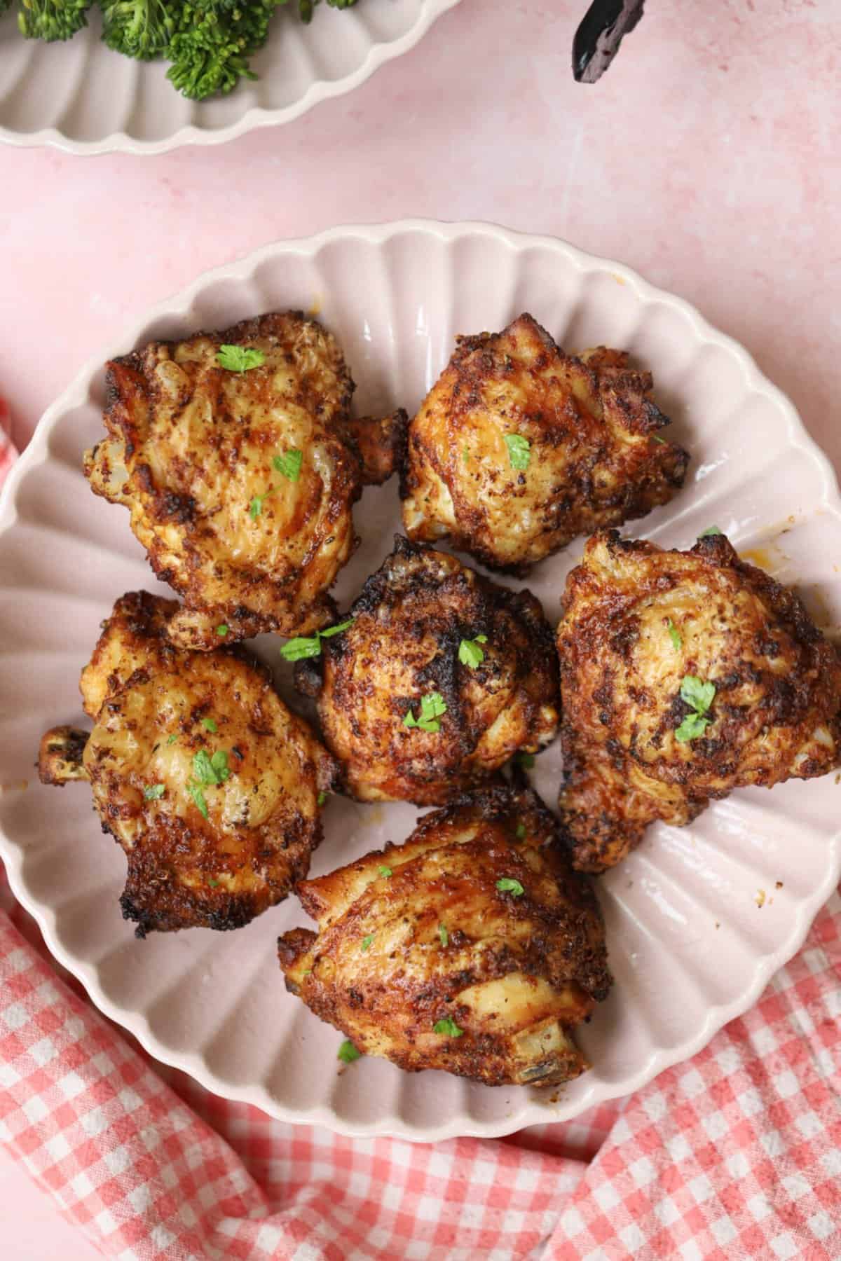 A plate of crispy gluten free air fryer chicken thighs.