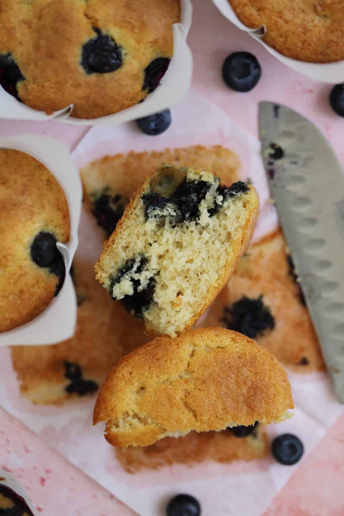 A gluten free blueberry muffin cut in half.