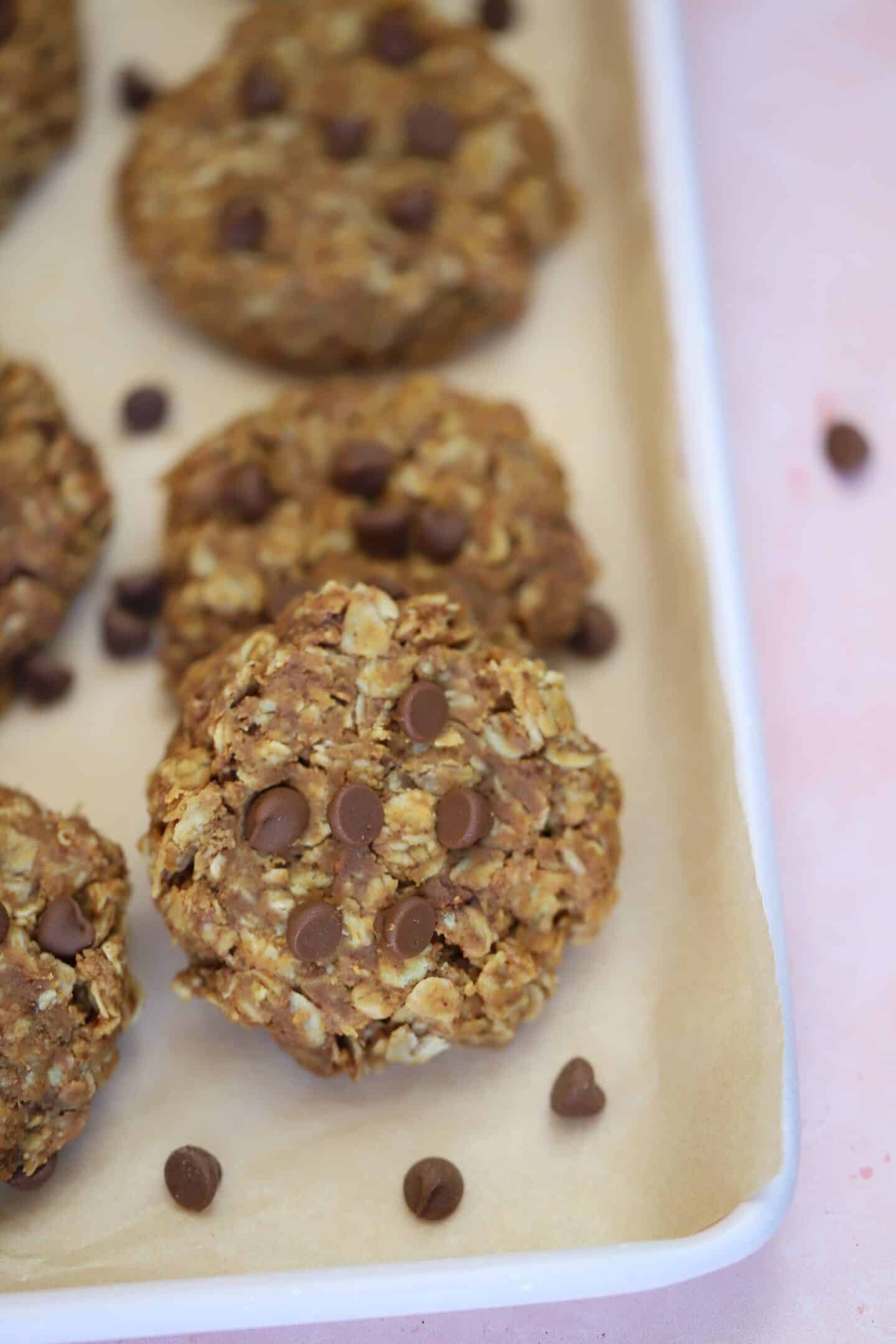 A tray of gluten free no bake cookies with chocolate chips.