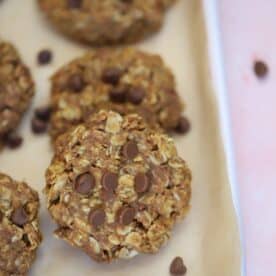 A tray of gluten free no bake cookies with chocolate chips.