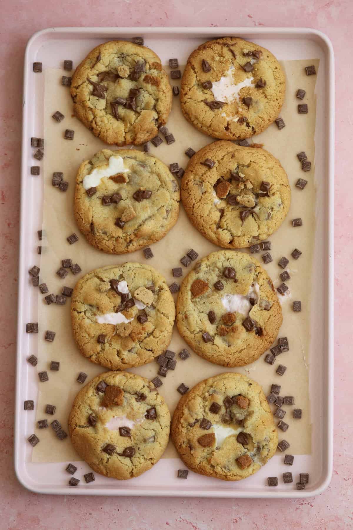 A tray of gluten free s'mores cookies on a pink backdrop.