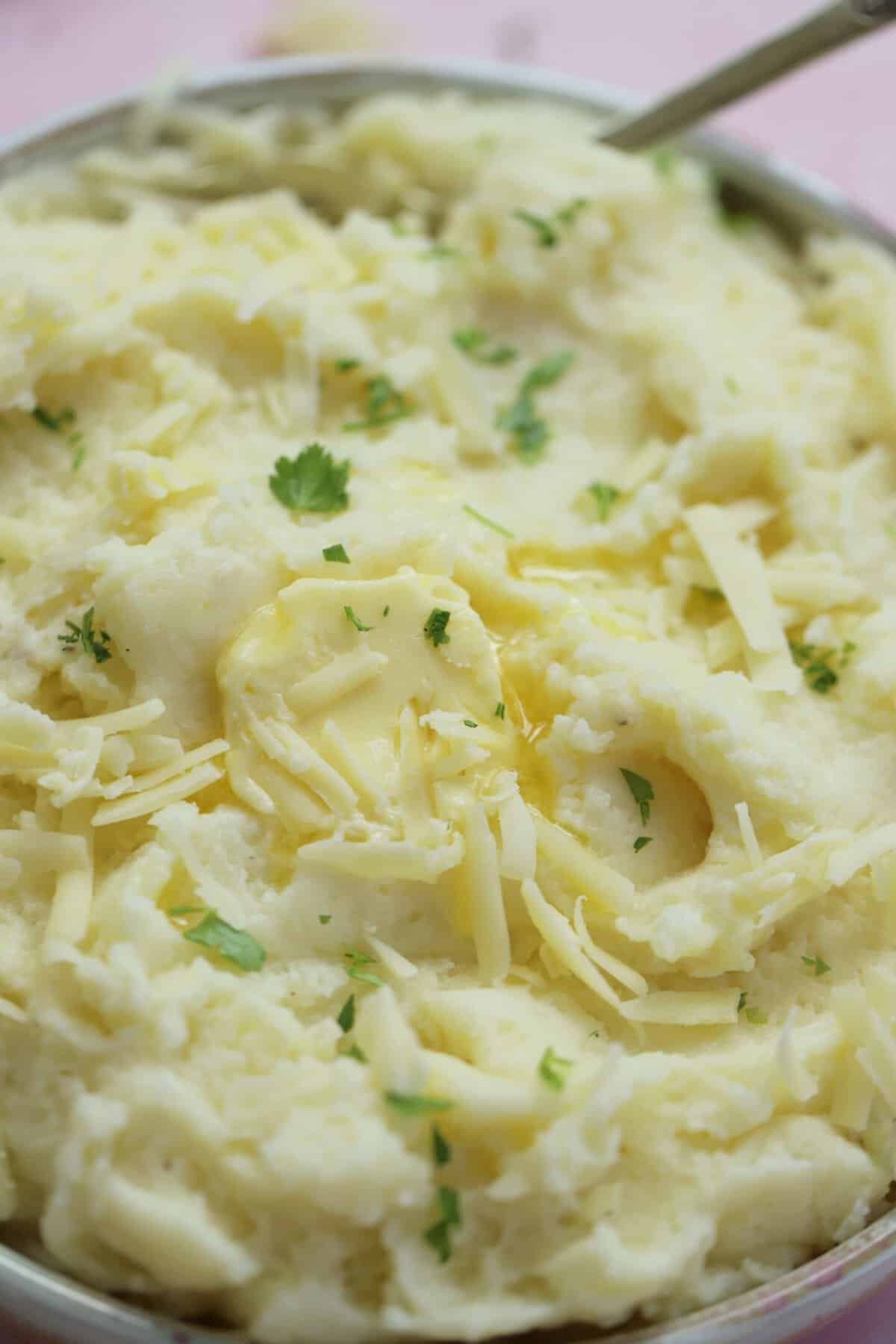 A bowl of gluten free cheesy mashed potato.