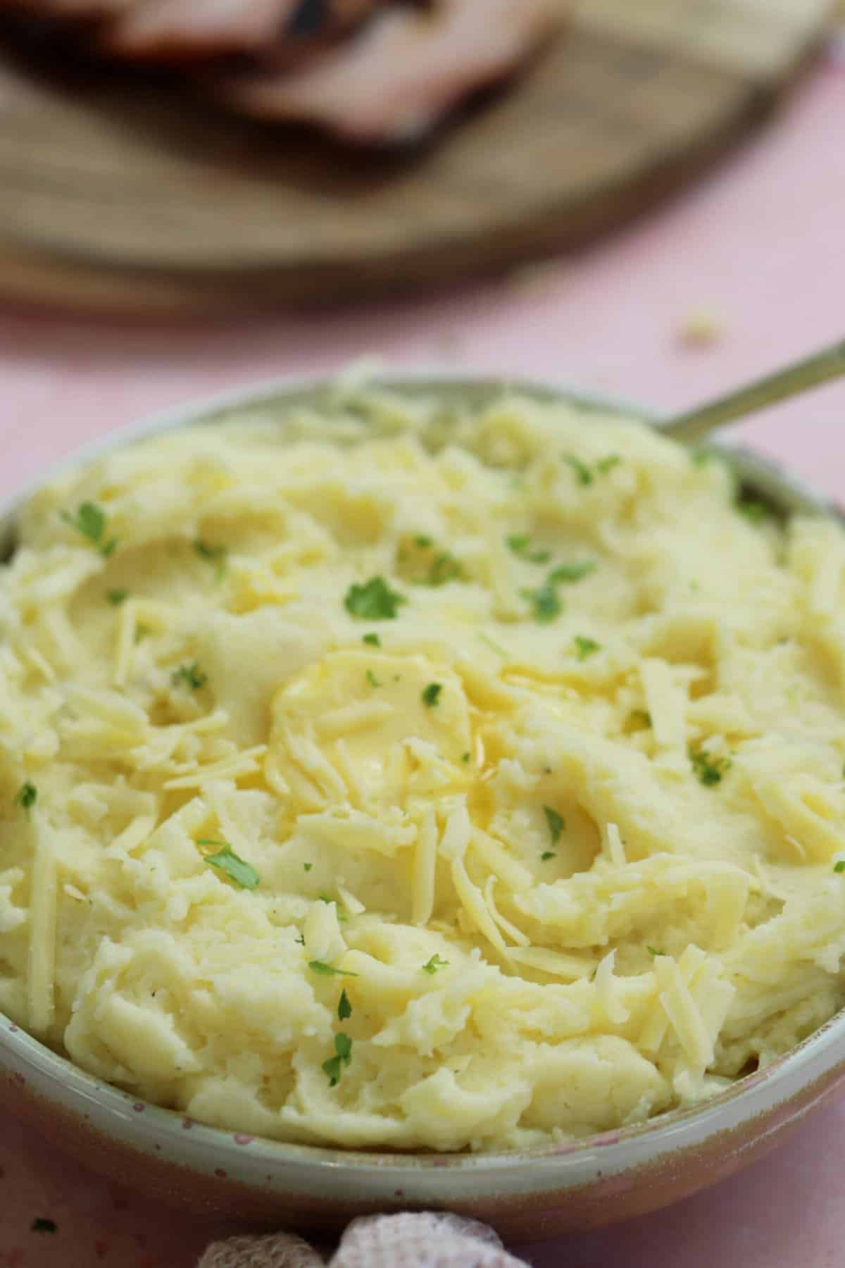 A bowl of gluten free cheesy mashed potato.