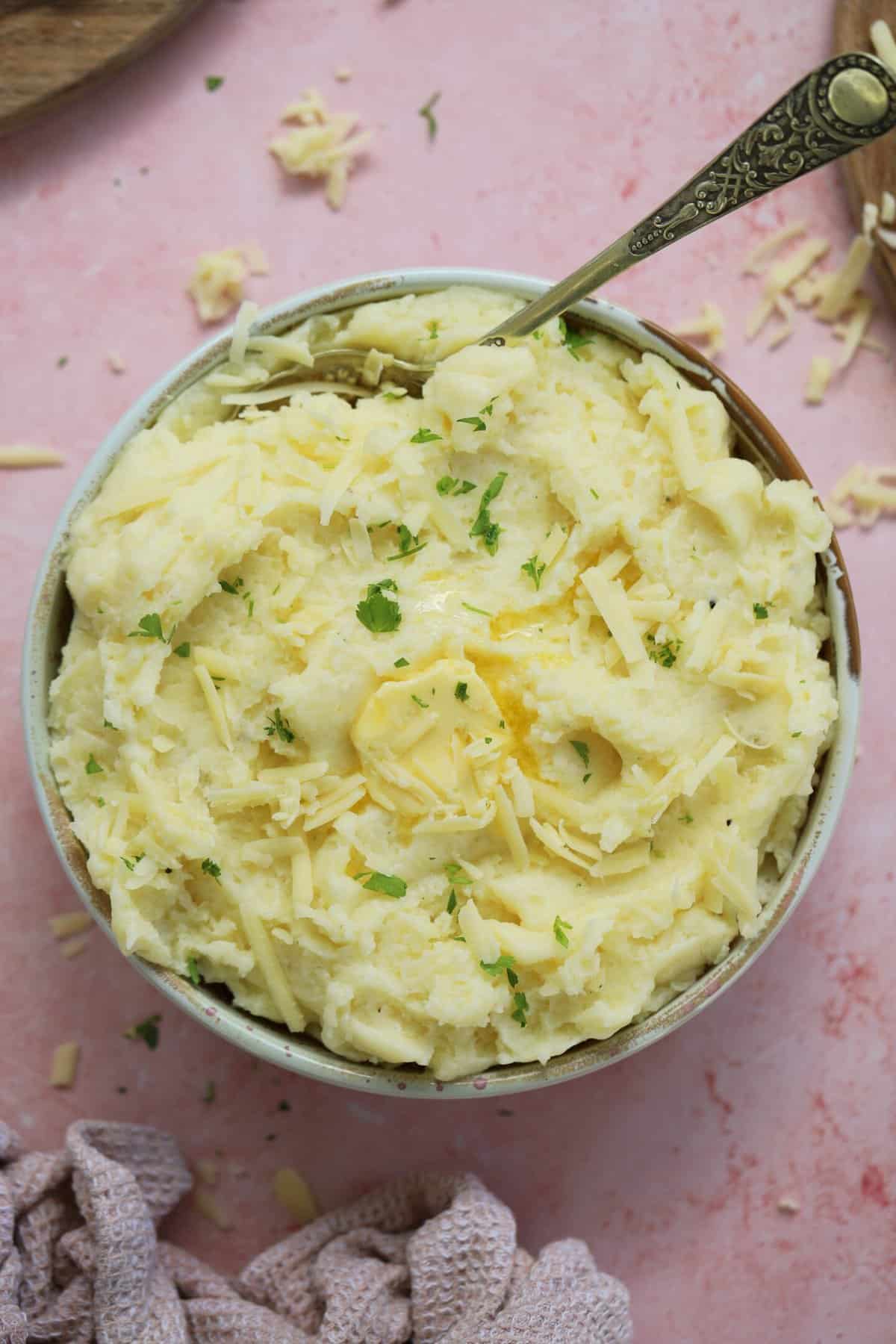 A bowl of gluten free cheesy mashed potato.