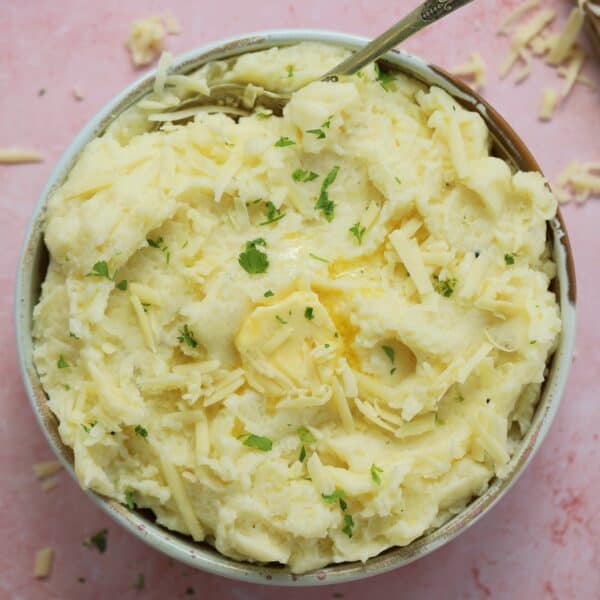 A bowl of gluten free cheesy mashed potato.