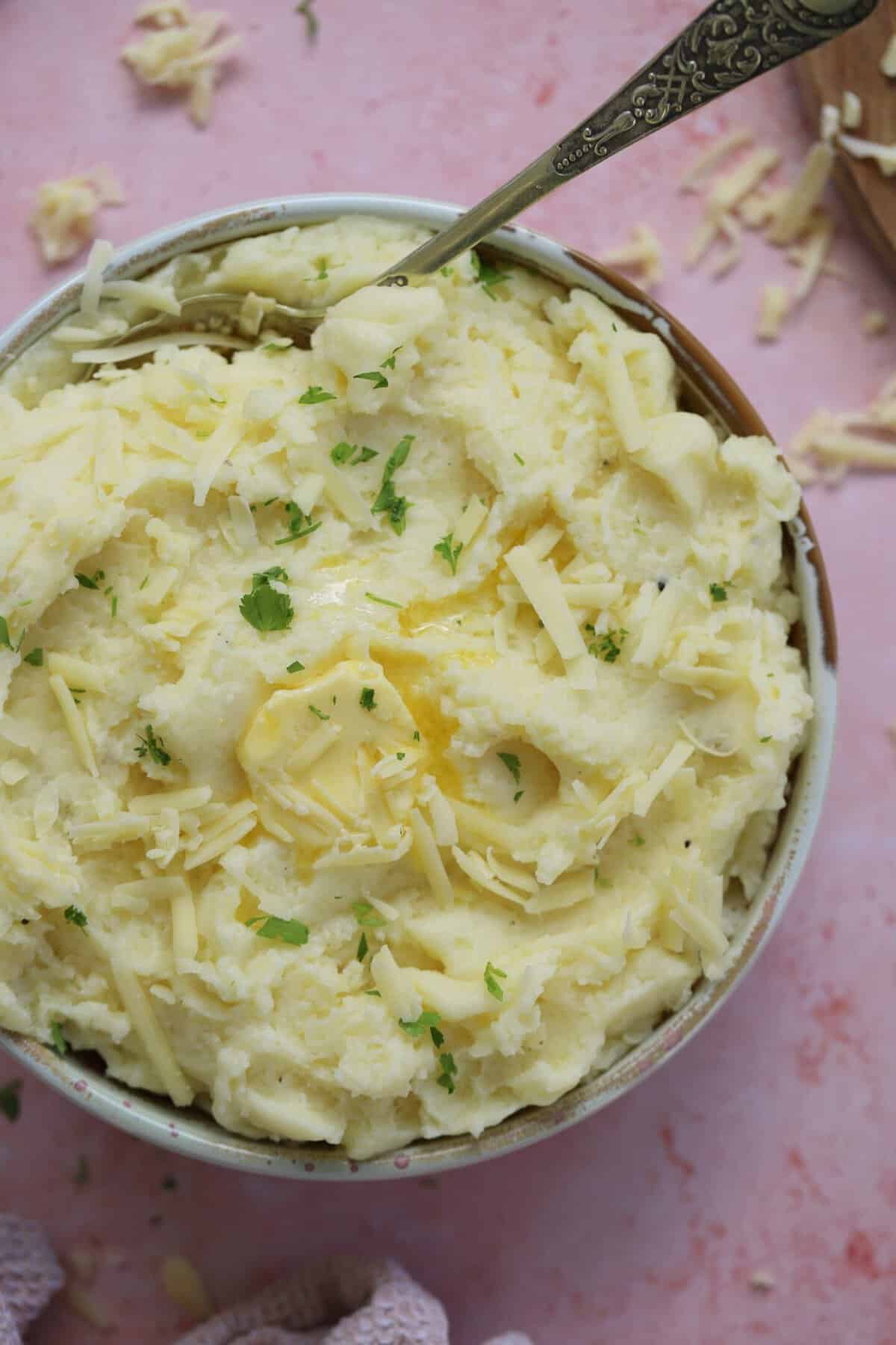 A bowl of gluten free cheesy mashed potato.