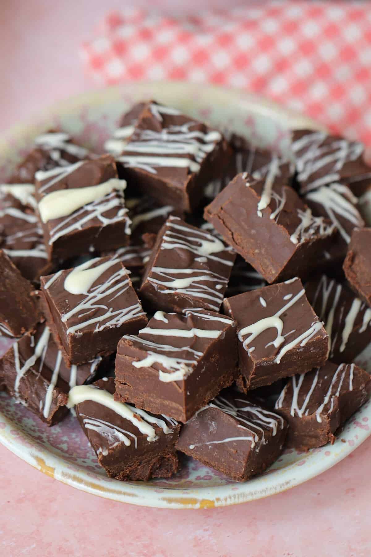 A plate of squares of slow cooker chocolate fudge.