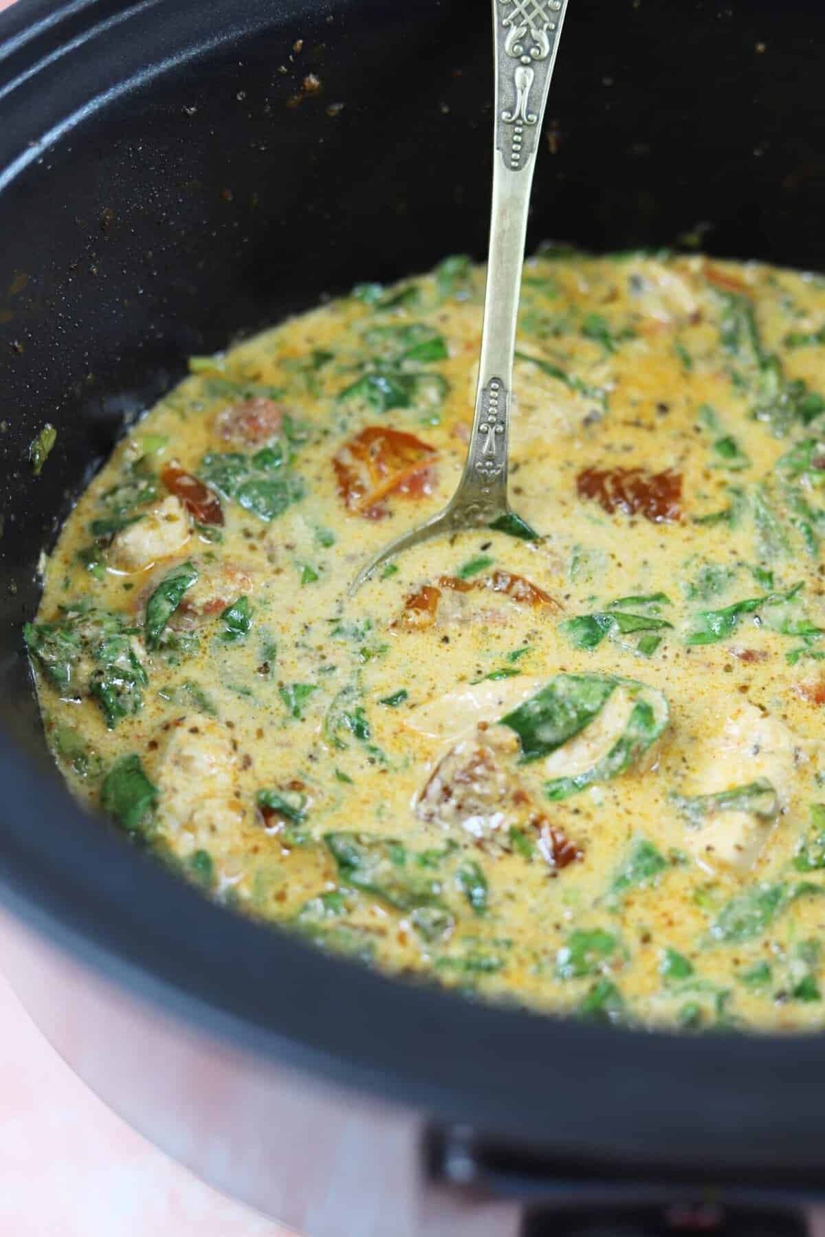 Slow cooker Tuscan chicken in a crock pot.