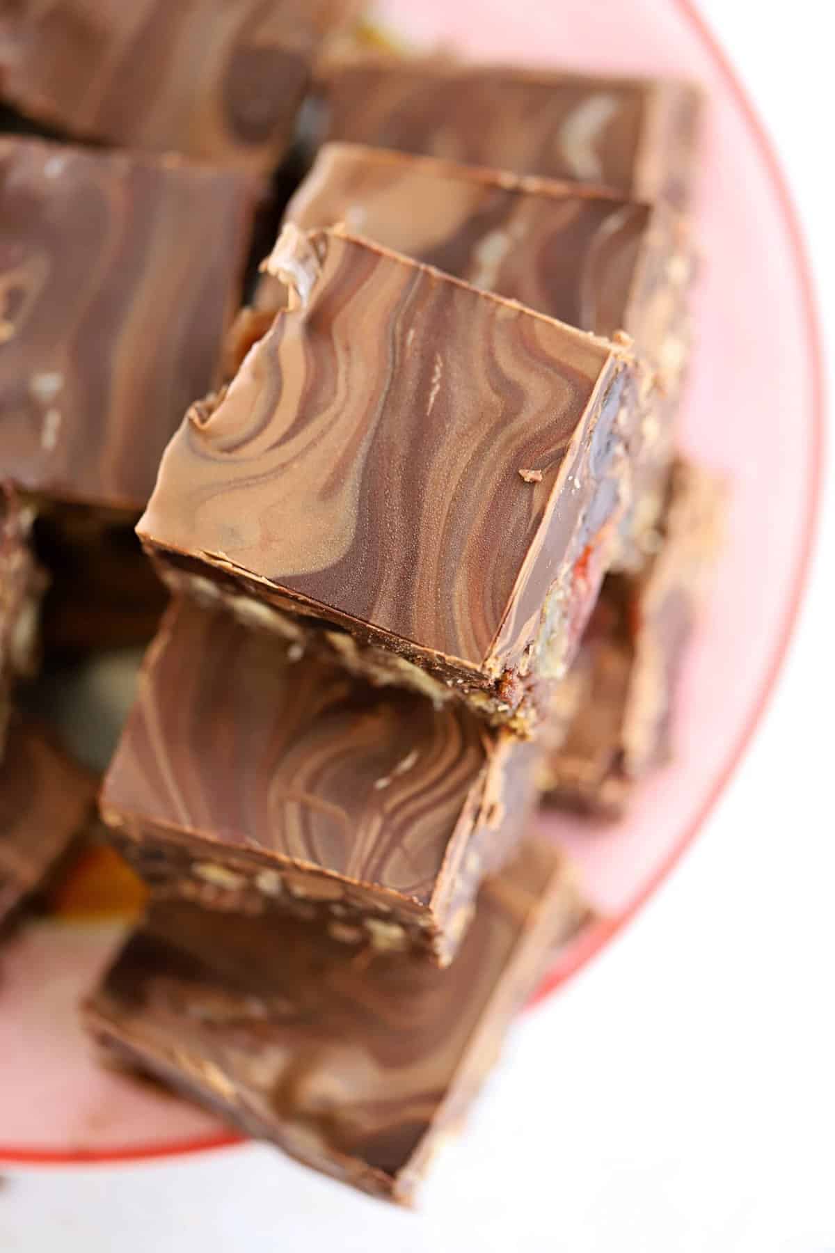 Overhead shot of a plate of gluten free chocolate tiffin squares.