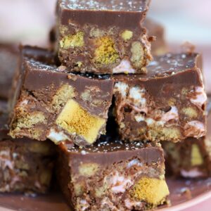 A plate of gluten free rocky roads with Crunchie pieces.