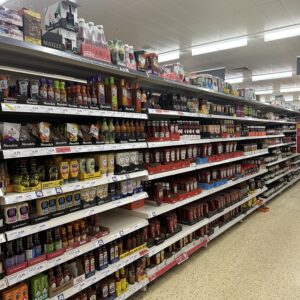 Supermarket shelves filled with sauces.