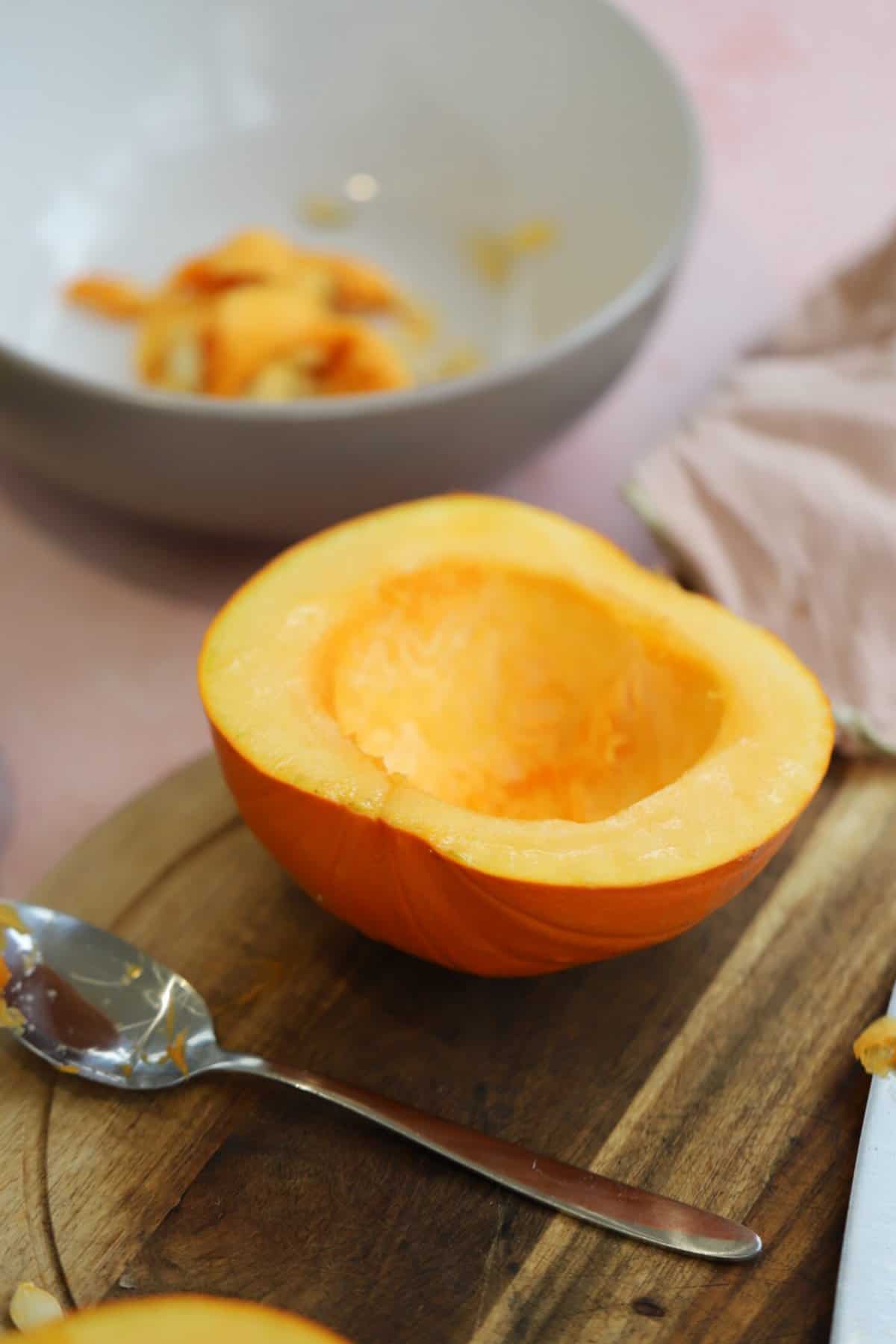 Half a pumpkin with the seeds scooped out of the centre.